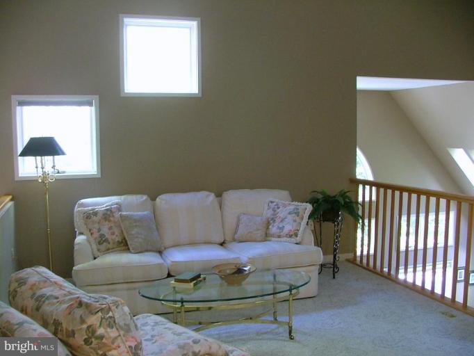 11591 Greenwich Point Road Reston, VA 20194 - Photo 17 of 30 a living room with furniture and a window