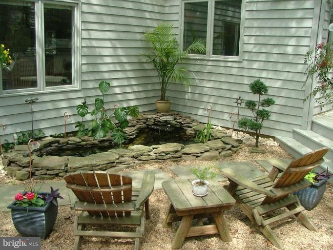 11591 Greenwich Point Road Reston, VA 20194 - Photo 22 of 30 a view of a backyard with chairs