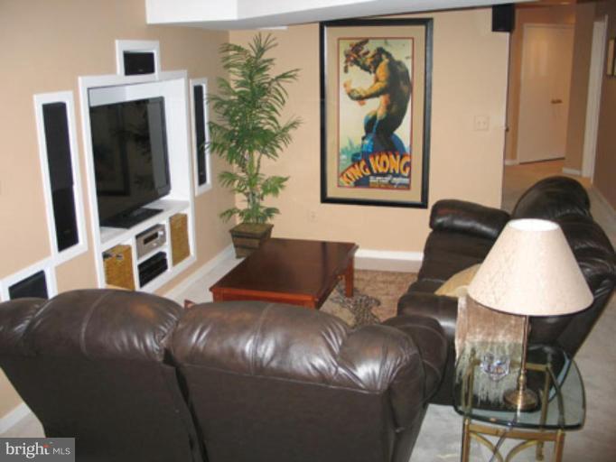 11591 Greenwich Point Road Reston, VA 20194 - Photo 24 of 30 a living room with furniture and a flat screen tv