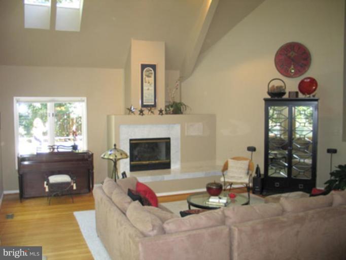 11591 Greenwich Point Road Reston, VA 20194 - Photo 4 of 30 a living room with furniture and a fireplace