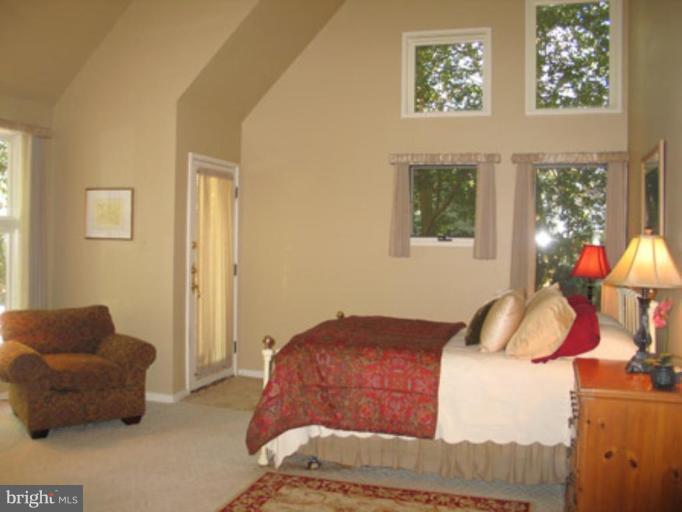 11591 Greenwich Point Road Reston, VA 20194 - Photo 9 of 30 a bedroom with furniture and a window