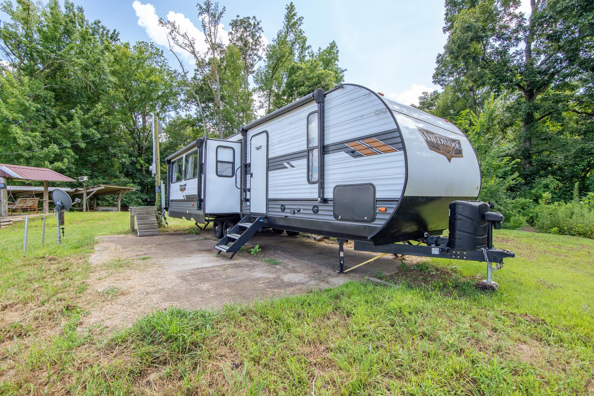 3360 Coffee Landing Road Morris Chapel, TN 38361 - Photo 11 of 36 a backyard of a house with table and chairs