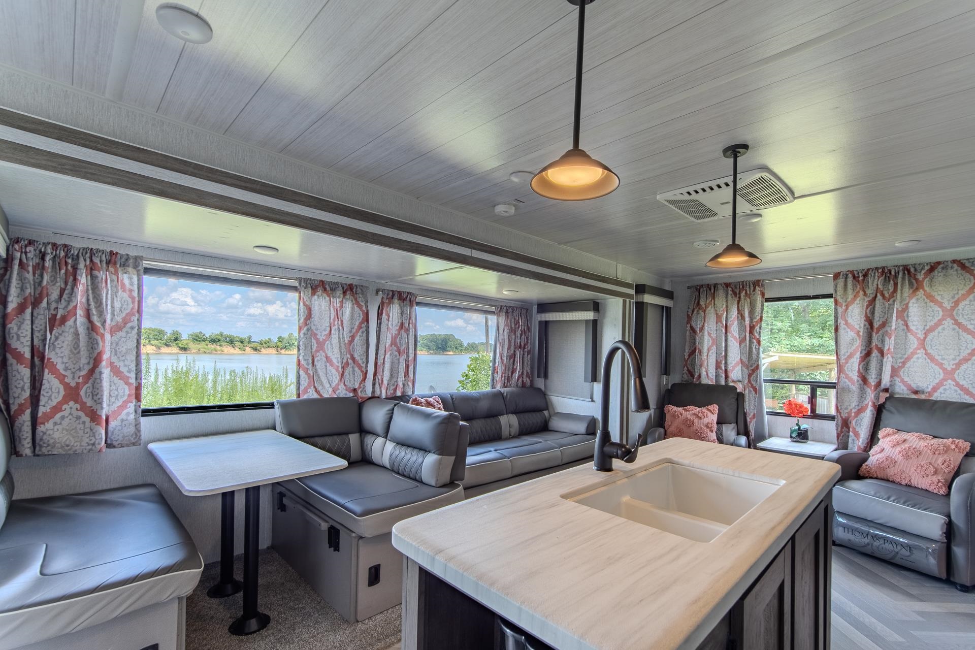 3360 Coffee Landing Road Morris Chapel, TN 38361 - Photo 14 of 36 a living room with furniture a window and a flat screen tv