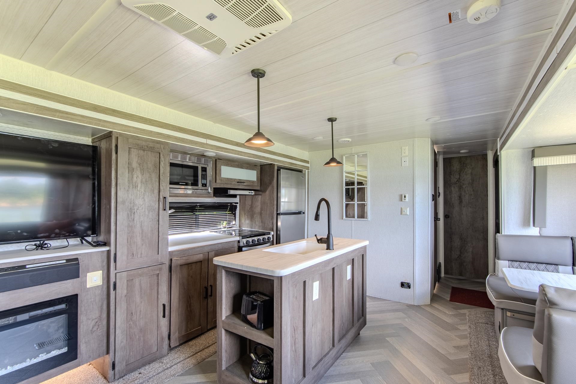 3360 Coffee Landing Road Morris Chapel, TN 38361 - Photo 15 of 36 a kitchen with a stove a refrigerator and a kitchen island