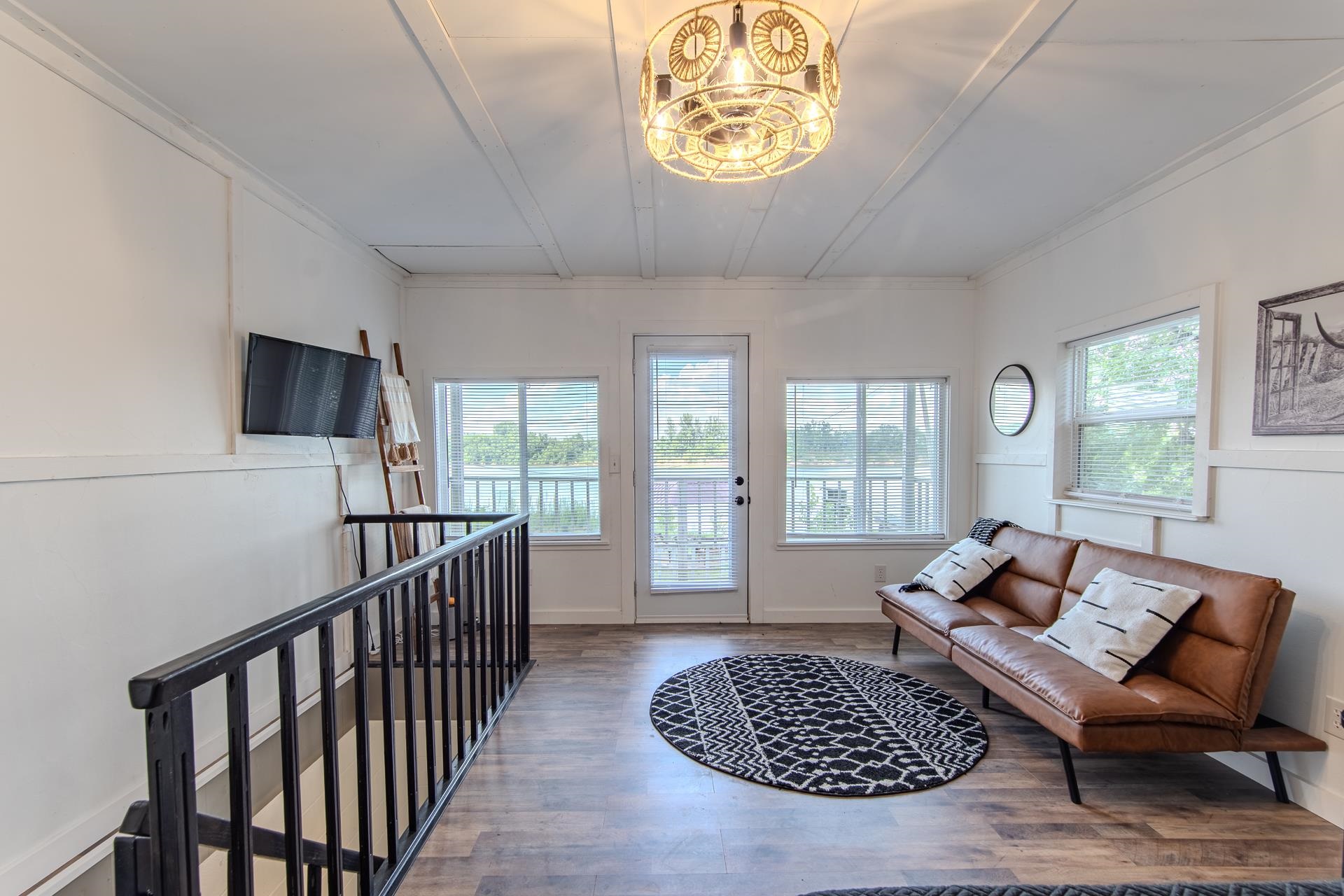 3360 Coffee Landing Road Morris Chapel, TN 38361 - Photo 7 of 36 a living room with furniture a rug and a floor to ceiling window