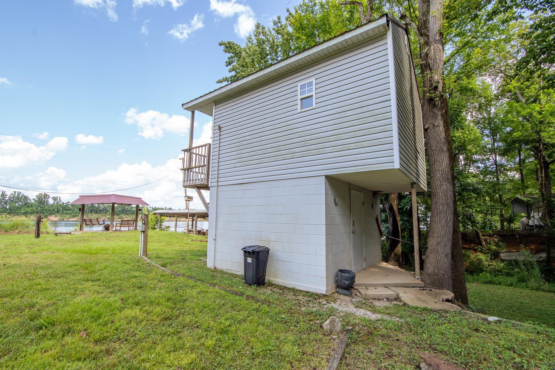 3360 Coffee Landing Road Morris Chapel, TN 38361 - Photo 9 of 36 a view of a house with backyard and trees