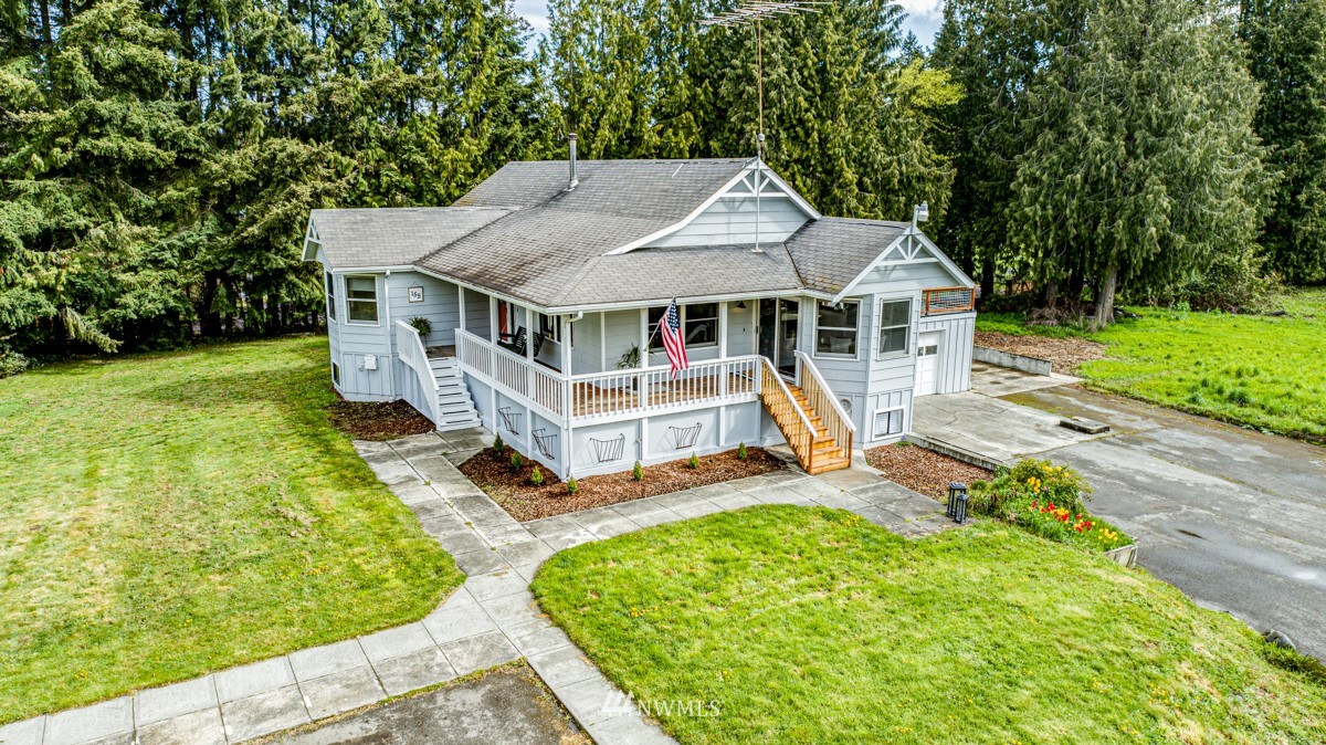 155 Taylor Cutoff Road Sequim, WA 98382 - Photo 2 of 37 an aerial view of a house with swimming pool garden and deck