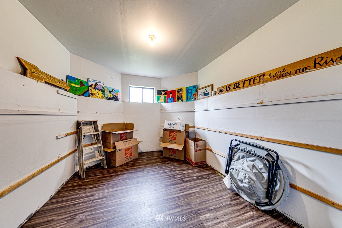 155 Taylor Cutoff Road Sequim, WA 98382 - Photo 22 of 37 a view of a storage & utility room with furniture and wooden floor