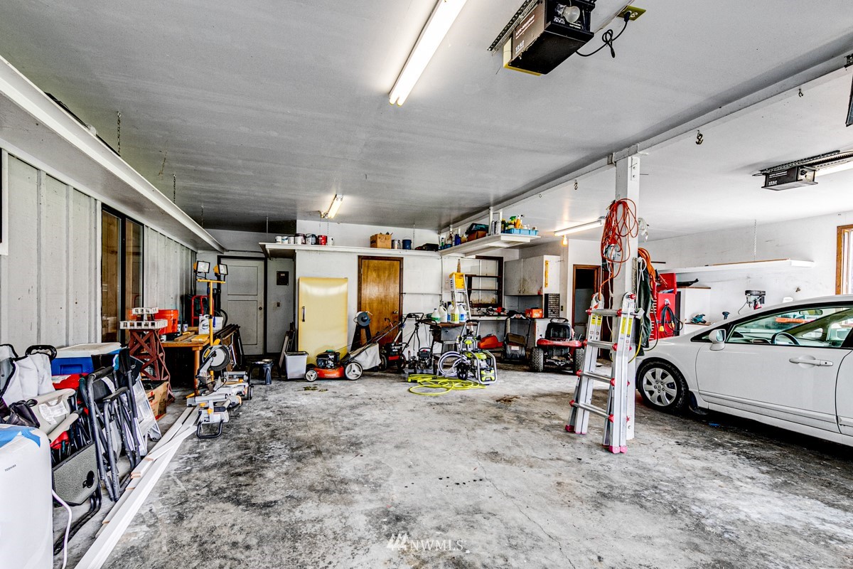 155 Taylor Cutoff Road Sequim, WA 98382 - Photo 25 of 37 a view of a garage with a bike and car