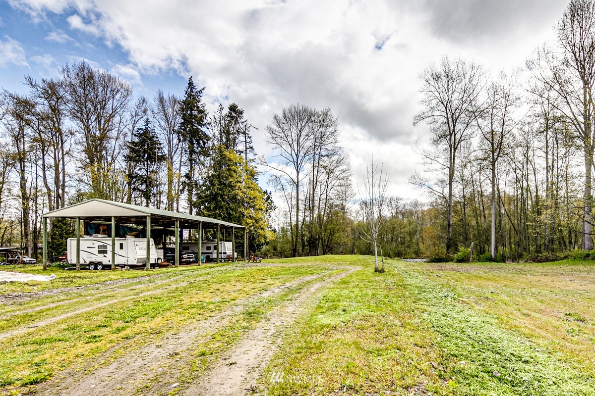 155 Taylor Cutoff Road Sequim, WA 98382 - Photo 30 of 37 a view of house with swimming pool