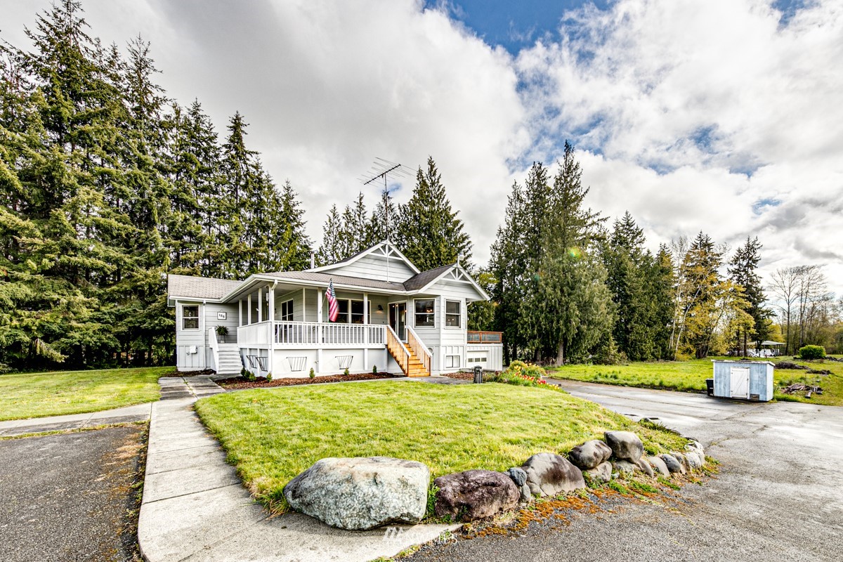 155 Taylor Cutoff Road Sequim, WA 98382 - Photo 3 of 37 a front view of a house with garden