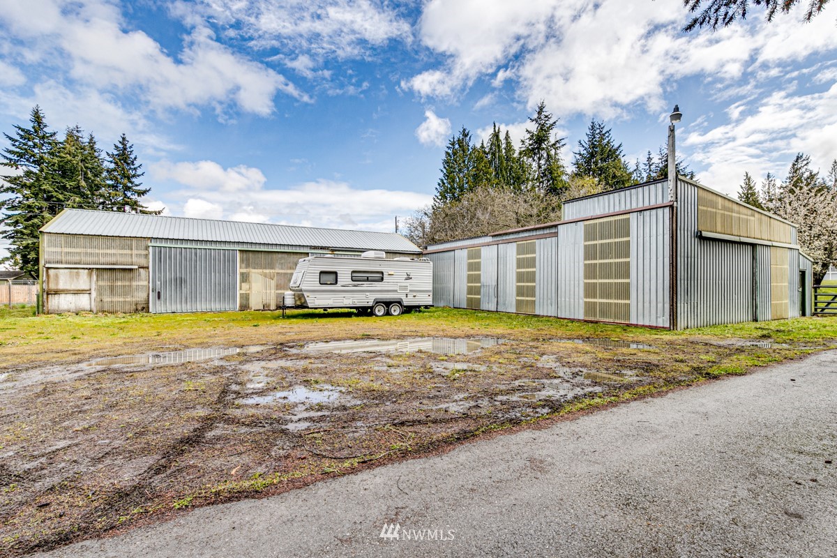 155 Taylor Cutoff Road Sequim, WA 98382 - Photo 33 of 37 a house that has a large window in it