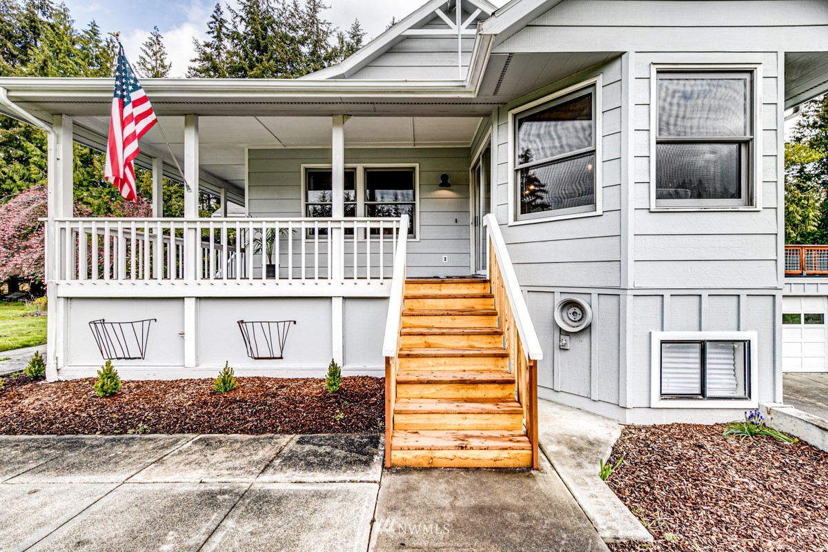 155 Taylor Cutoff Road Sequim, WA 98382 - Photo 4 of 37 a view of a house with entrance gate
