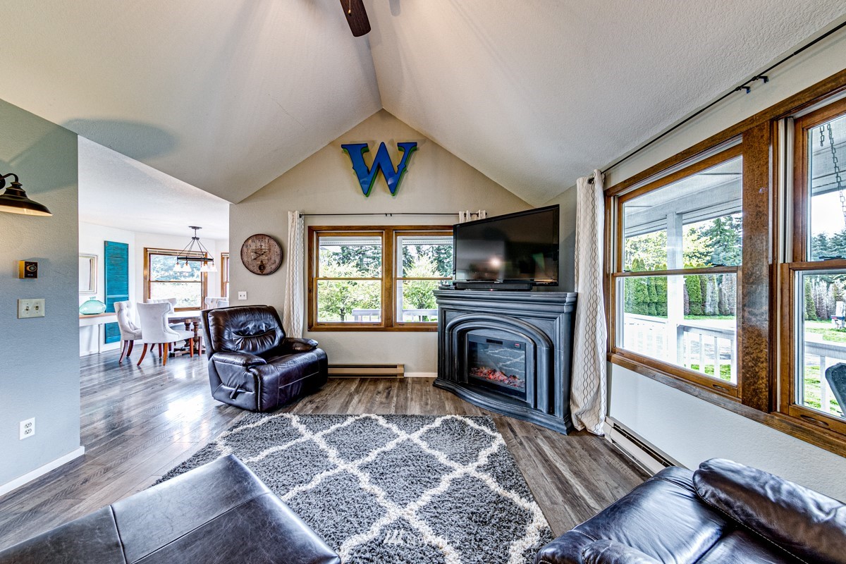 155 Taylor Cutoff Road Sequim, WA 98382 - Photo 6 of 37 a living room with furniture and a fireplace