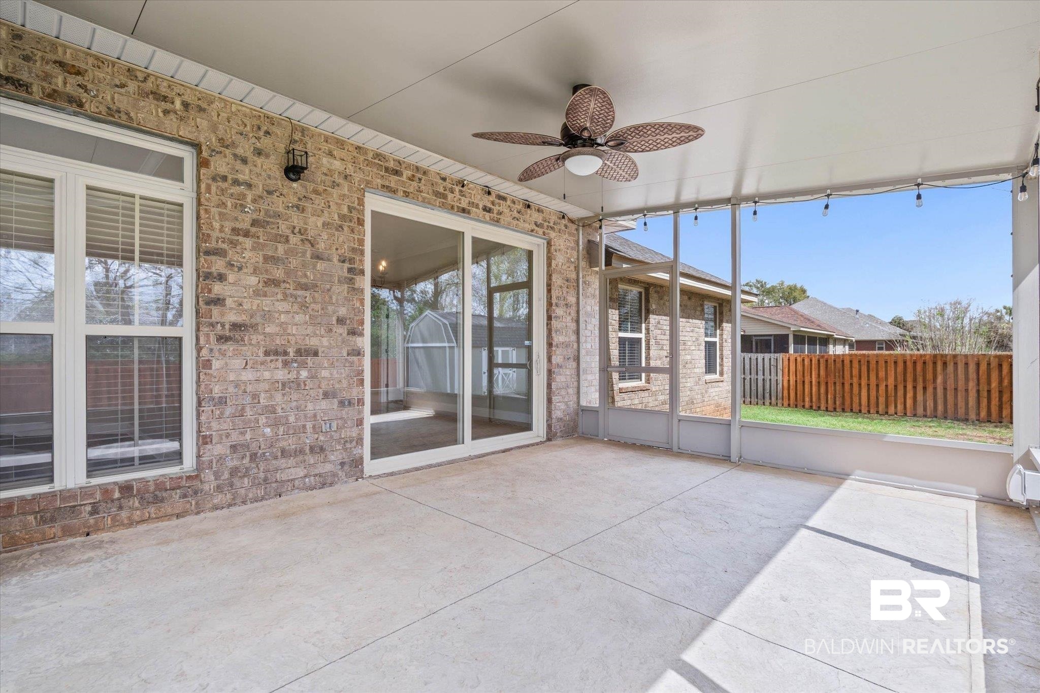 704 Edinburgh Avenue Foley, AL 36535 - Photo 29 of 32 Unfurnished sunroom featuring a ceiling fan