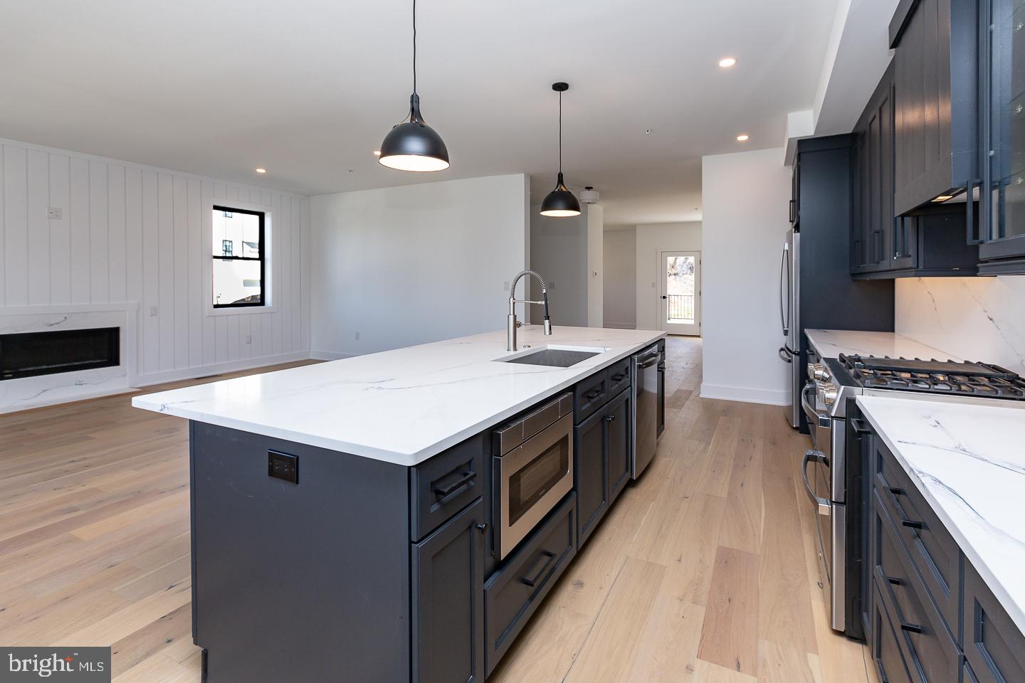981 Henry Avenue Wayne, PA 19087 - Photo 15 of 32 Sleek modern kitchen with island charm.