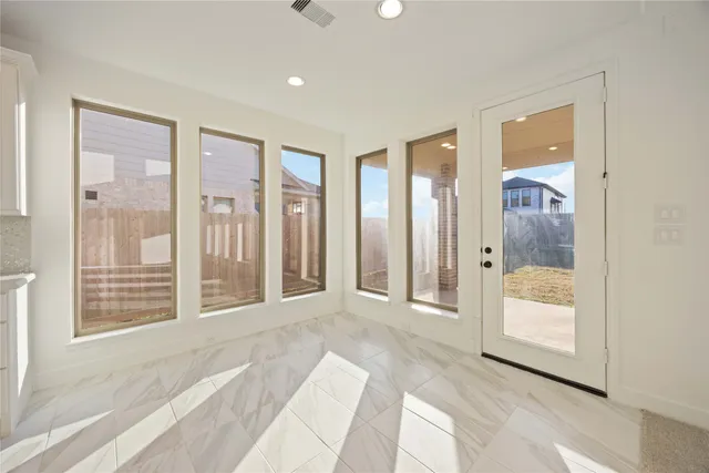 a view of a bathroom with a glass door shower