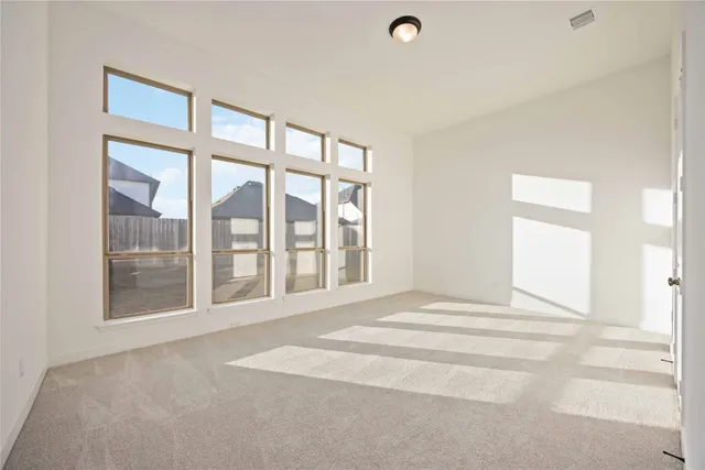 a view of an empty room with a balcony