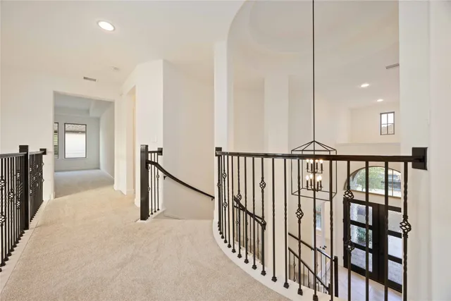 a view of a hallway with a window