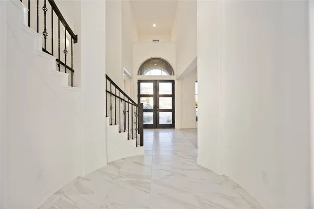 wooden floor in a hall with a window and wooden floor