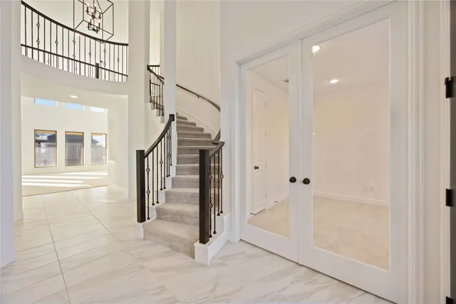a view of entryway with wooden floor and stairs