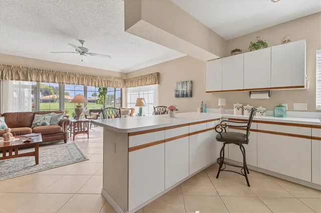 a kitchen with a sink stove and microwave