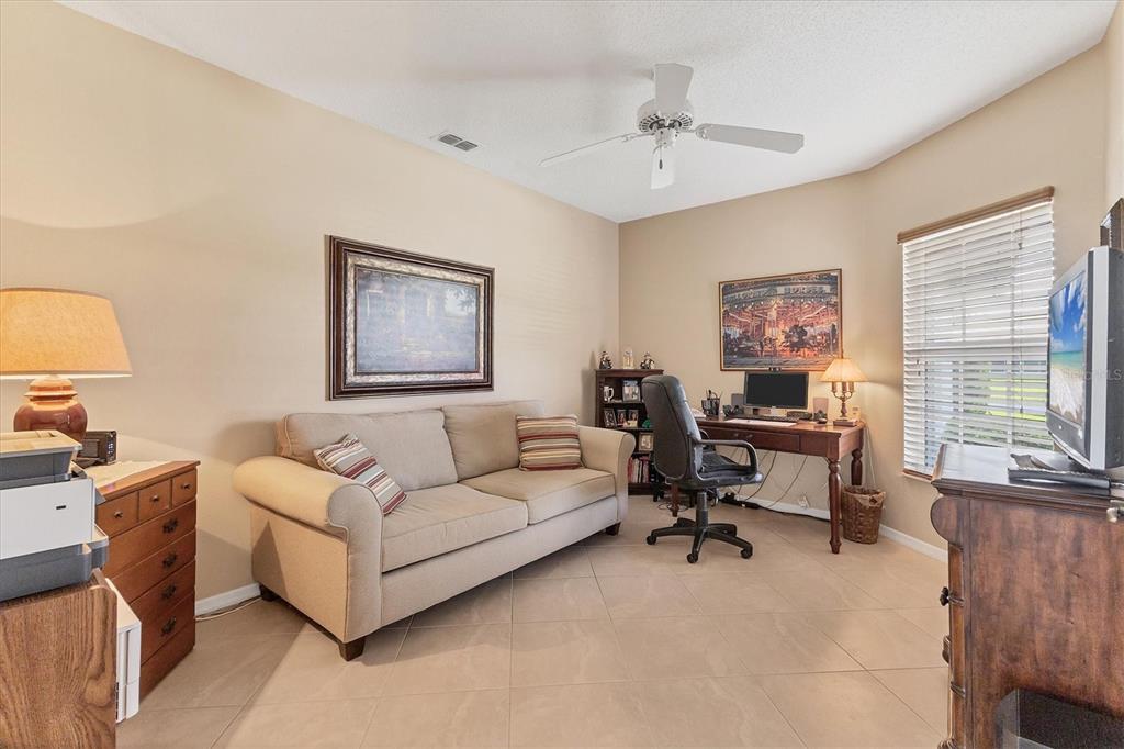 1412 Colony Place Venice, FL 34292 - Photo 19 of 55 a living room with furniture and a window