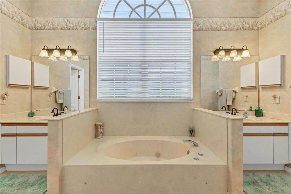 1412 Colony Place Venice, FL 34292 - Photo 25 of 55 a bathroom with a bathtub and a sink
