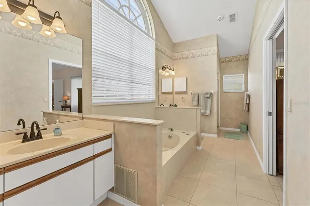 a bed room with a bed and a chair