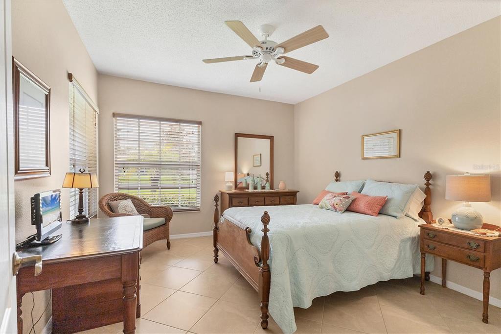 1412 Colony Place Venice, FL 34292 - Photo 29 of 55 a bedroom with a bed and a large window