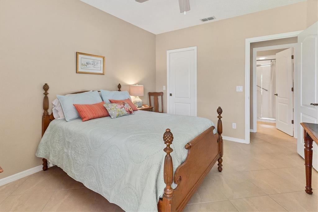 1412 Colony Place Venice, FL 34292 - Photo 30 of 55 a bed room with a bed and a chair