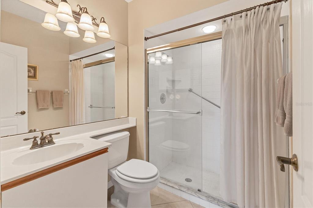 1412 Colony Place Venice, FL 34292 - Photo 31 of 55 a bathroom with a sink a toilet and shower