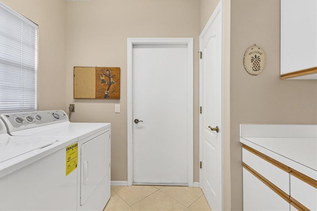 1412 Colony Place Venice, FL 34292 - Photo 32 of 55 a utility room with dryer and washer