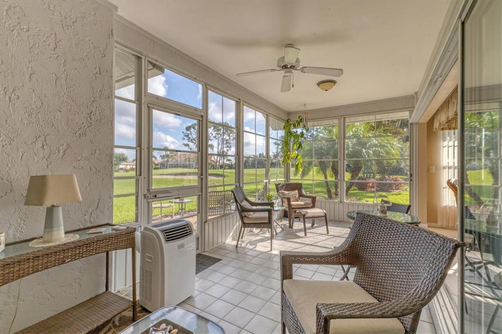 1412 Colony Place Venice, FL 34292 - Photo 34 of 55 a living room with furniture and large windows