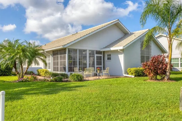 a view of outdoor space with playground and green space