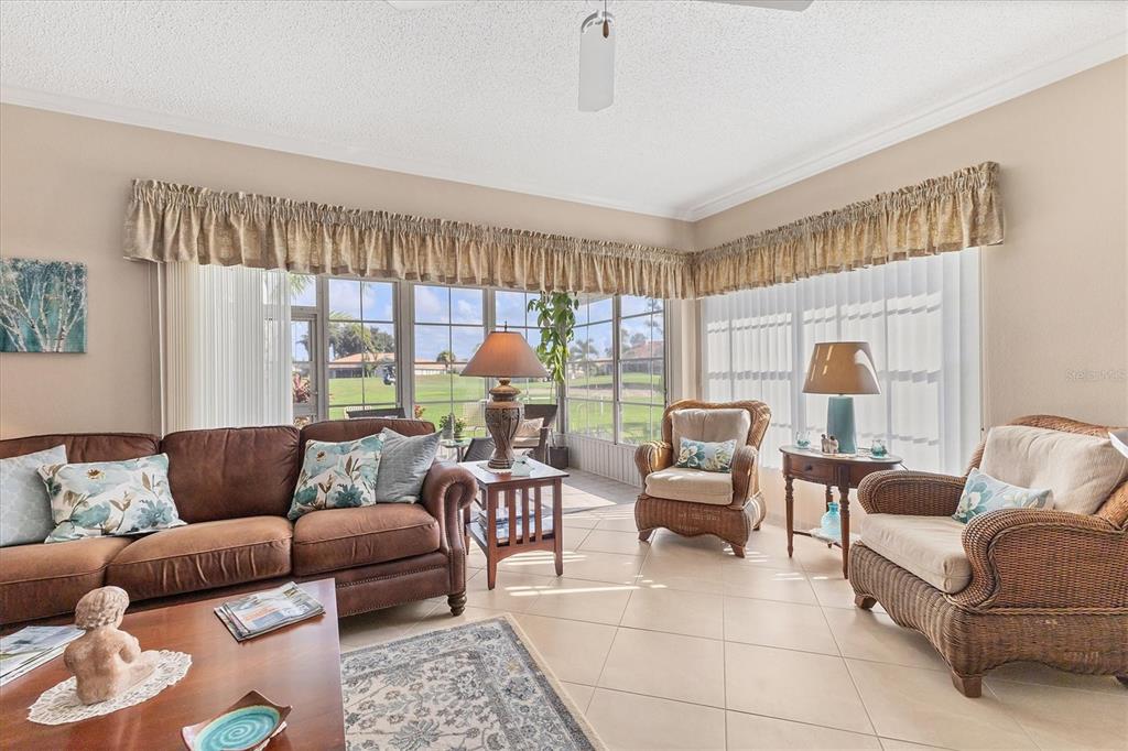 1412 Colony Place Venice, FL 34292 - Photo 8 of 55 a living room with furniture and a large window