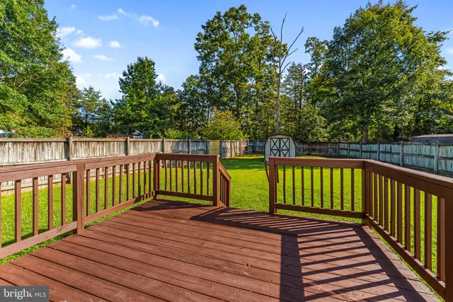 a view of a house with deck and wooden deck