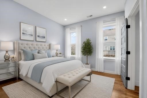 31 Homestead Street, Unit 2 Boston, MA 02121 - Photo 16 of 21 a spacious bedroom with a large bed and a couch