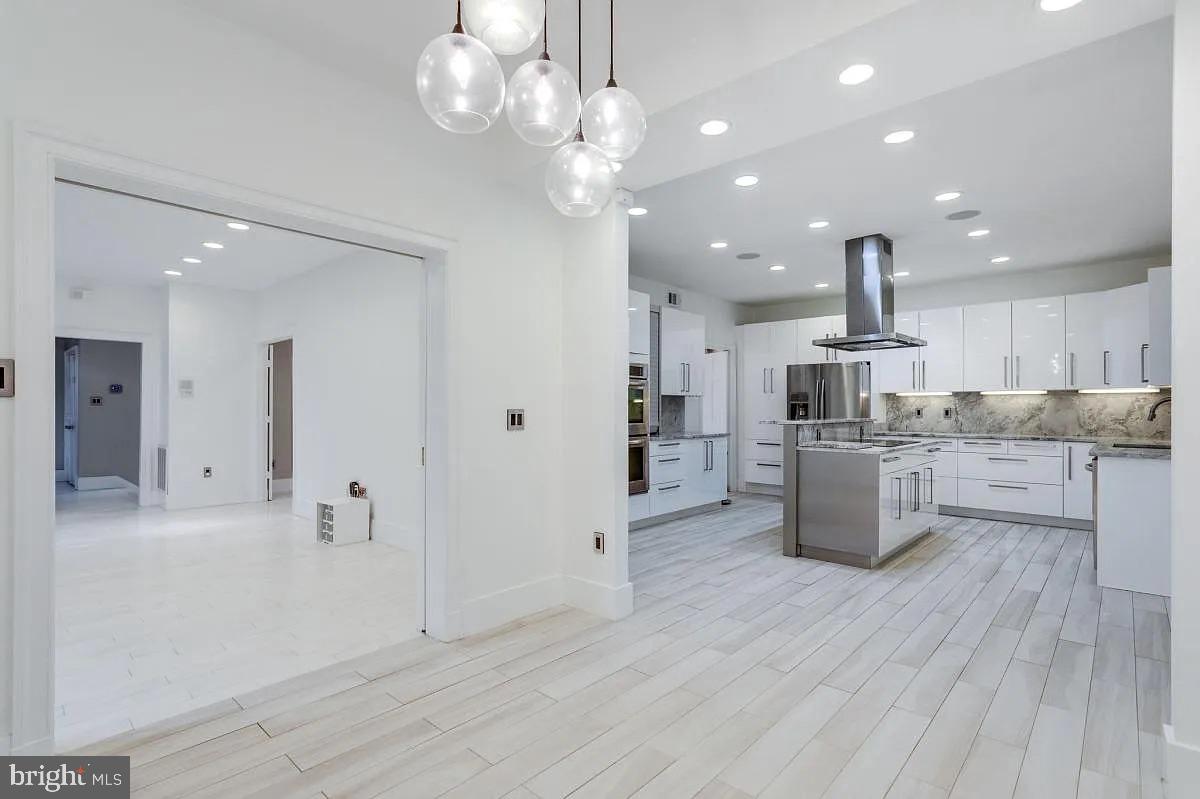 4611 Charleston Terrace Northwest Washington, DC 20007 - Photo 11 of 55 a large kitchen with cabinets