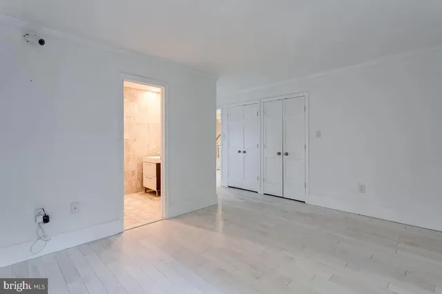 a bathroom with a sink mirror and shower