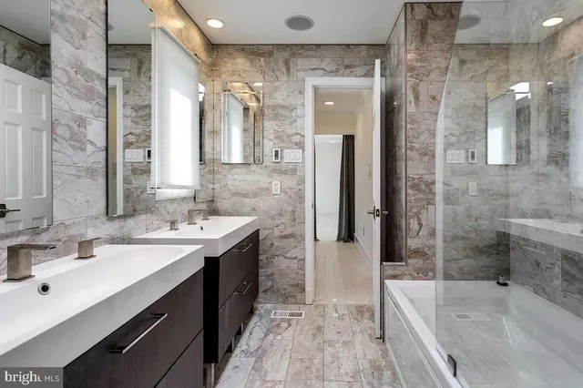 a bathroom with a bathtub and shower