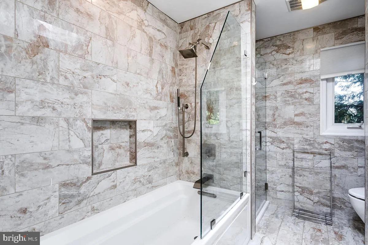 4611 Charleston Terrace Northwest Washington, DC 20007 - Photo 33 of 55 a bathroom with a bathtub and shower