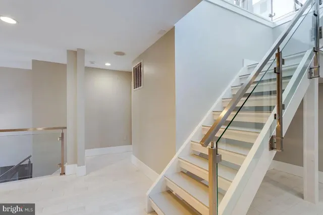 a kitchen with a sink appliances and cabinets