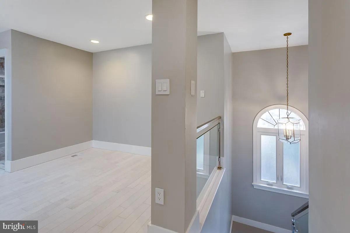 4611 Charleston Terrace Northwest Washington, DC 20007 - Photo 40 of 55 a very nice looking room with a chandelier