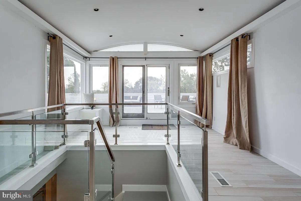 4611 Charleston Terrace Northwest Washington, DC 20007 - Photo 42 of 55 a room with a large window and a chandelier