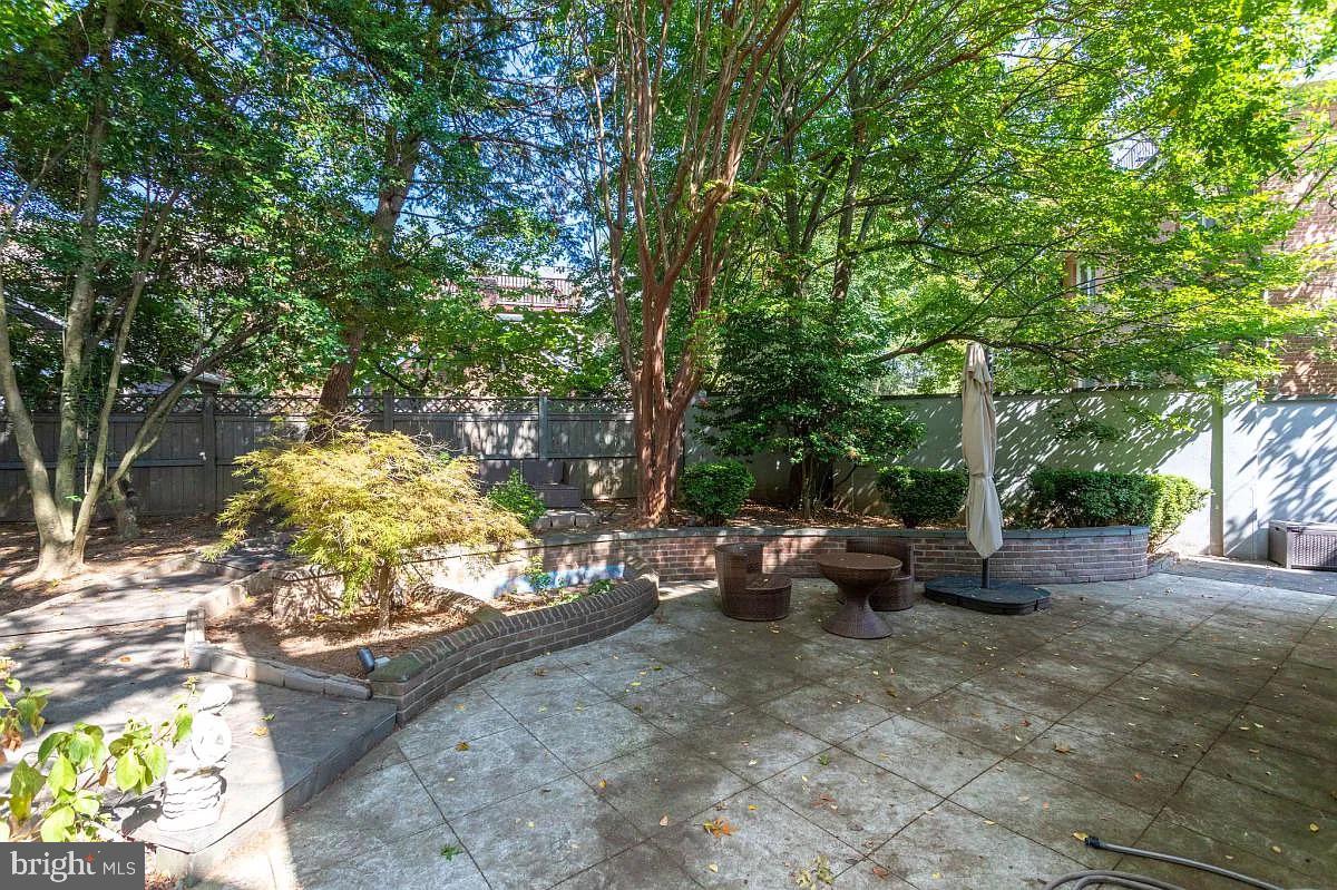 4611 Charleston Terrace Northwest Washington, DC 20007 - Photo 48 of 55 a view of a backyard with furniture and a fire pit