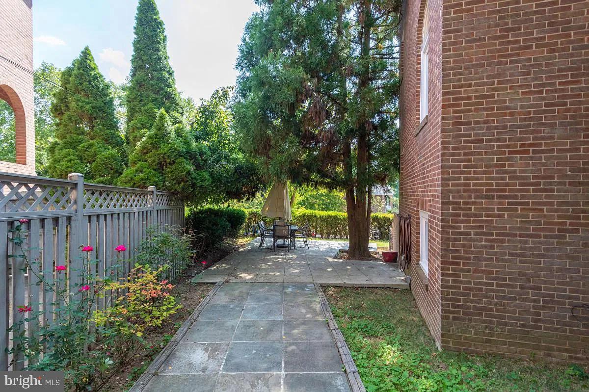 4611 Charleston Terrace Northwest Washington, DC 20007 - Photo 50 of 55 a view of a garden with flowers and trees