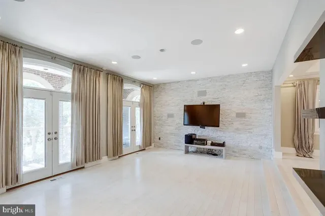 a view of a livingroom with furniture and a flat screen tv