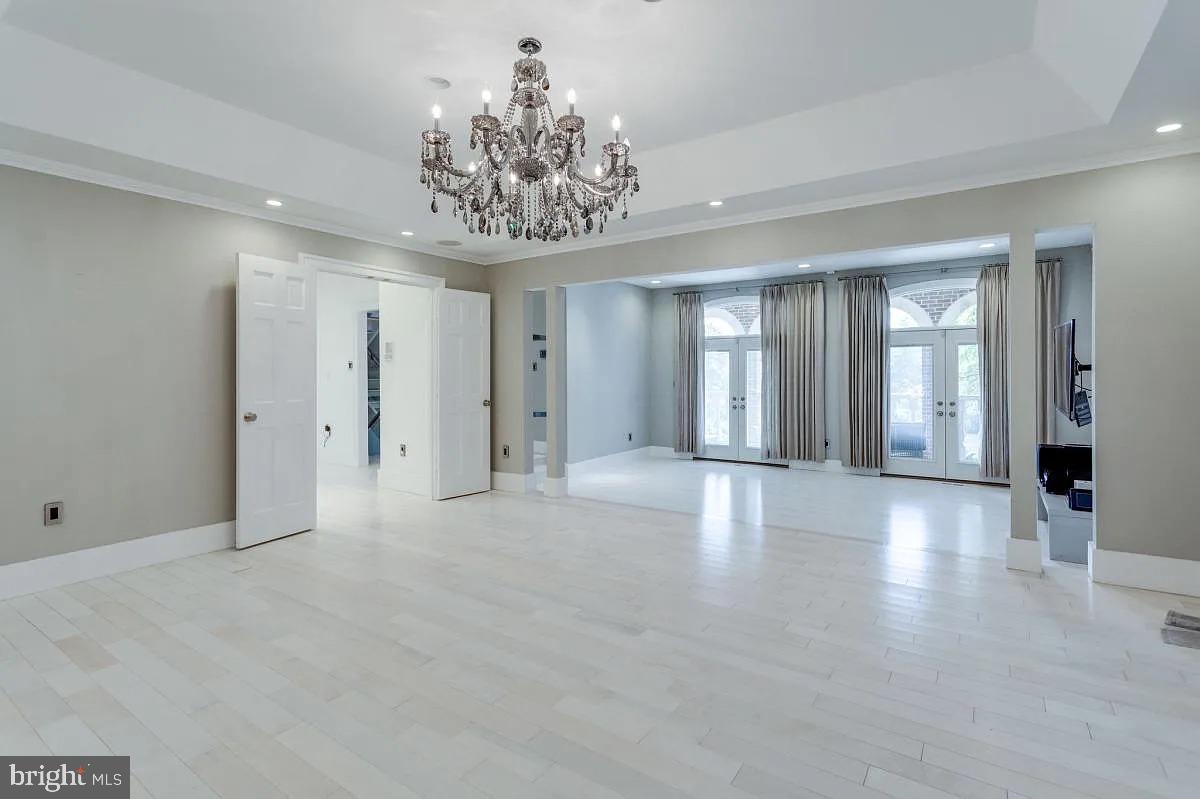 4611 Charleston Terrace Northwest Washington, DC 20007 - Photo 8 of 55 a view of an empty room with a chandelier