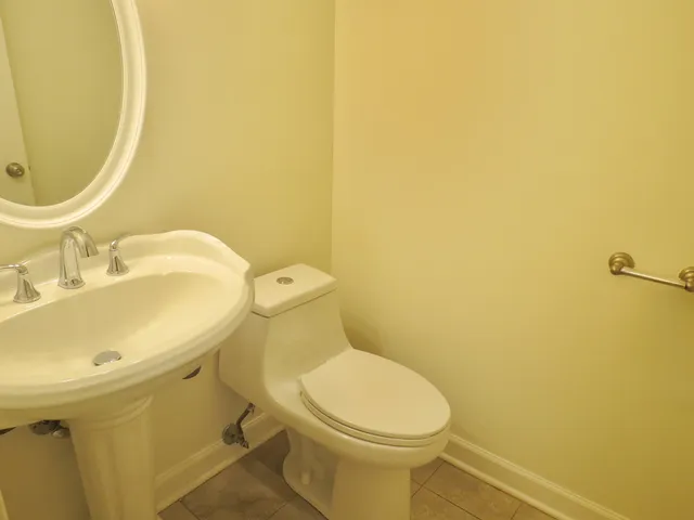 a view of an empty room with a large window